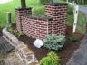 Brick Wall with Stone Retaining Wall