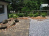 Natural and Grey Pavers with Boulders and Gravel