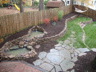 Multi-level Pond with Waterfall, Stone Retaining Walls, and Flagstone Pathway